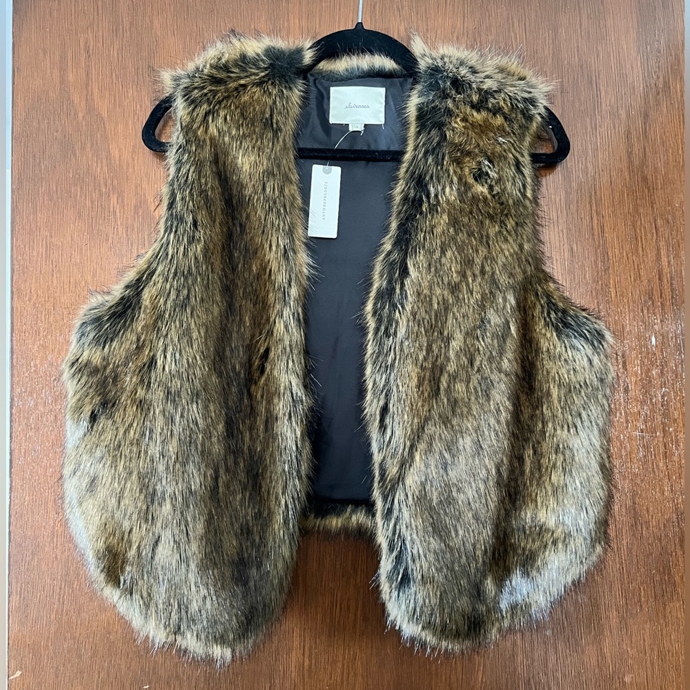 Faux fur vest. Size M. New. Never worn.